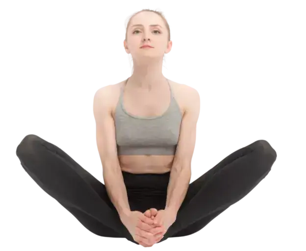  "Yoga practitioner sitting in Bound Angle Pose with soles of feet together."