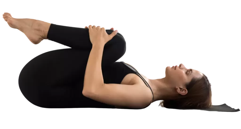  "Yoga practitioner hugging right knee into chest in supine position." Title attribute: "Knee to Chest stretches lower back, hips and knees in reclining position."