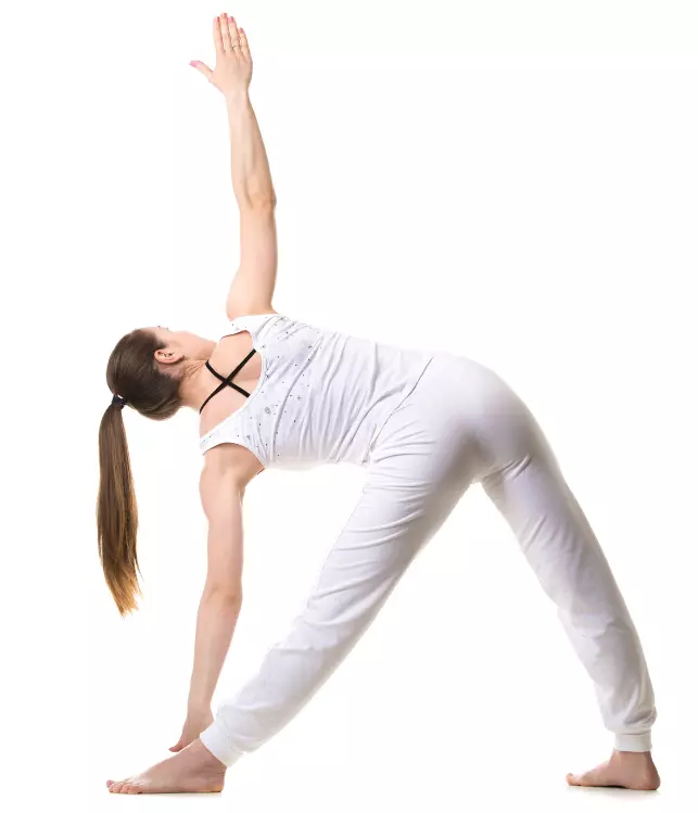 "Yoga practitioner in Triangle Pose with arm reaching up and back."